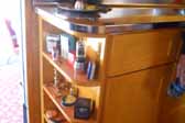 Photo of cool curved shelf curio cabinet in 1948 Spartan Manor Trailer